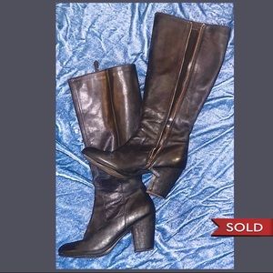 Knee high black leather high heeled zip up mystery boots, size 6